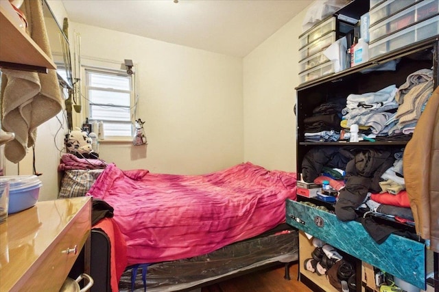 bedroom featuring hardwood / wood-style floors