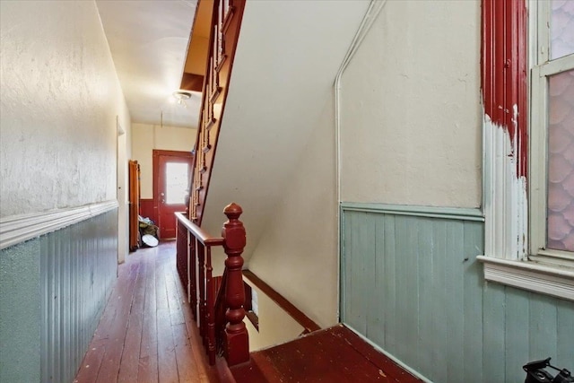 stairway featuring hardwood / wood-style flooring