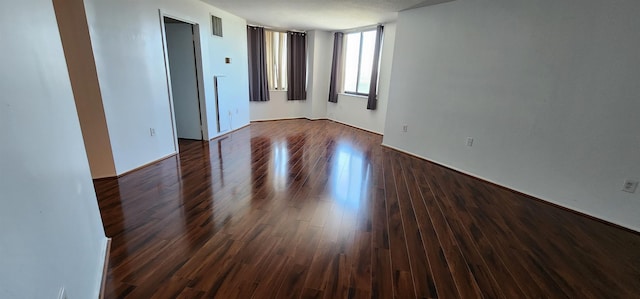 Harmon Cove Tower 336, Secaucus, NJ 07094 - spare room with dark wood finished floors and baseboards