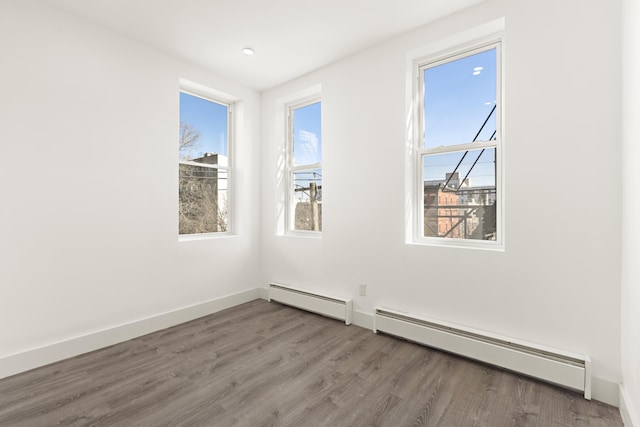 235 Monroe St Unit 10, Hoboken, NJ 07030 - unfurnished room with baseboard heating and wood finished floors