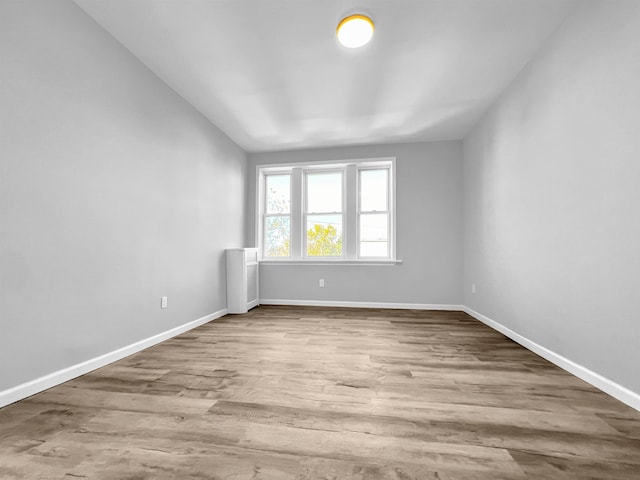 spare room with light hardwood / wood-style floors