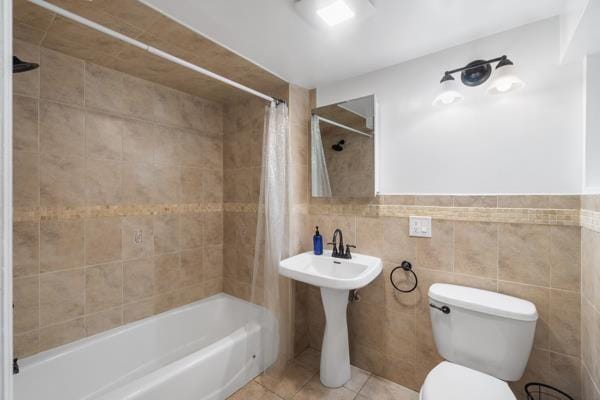 2608 Kennedy Blvd Unit 1, Union City, NJ 07087 - full bath with shower / bathtub combination with curtain, tile walls, and tile patterned flooring