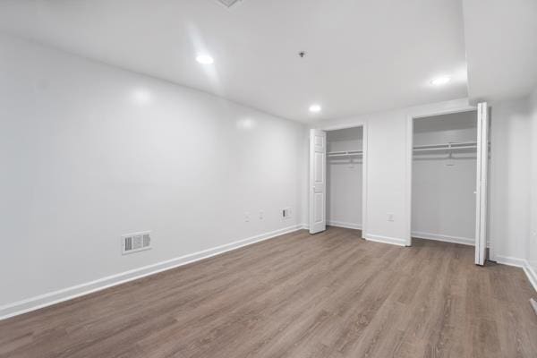 2608 Kennedy Blvd Unit 1, Union City, NJ 07087 - unfurnished bedroom with two closets, wood finished floors, and recessed lighting