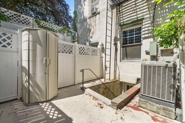 2608 Kennedy Blvd Unit 1, Union City, NJ 07087 - view of patio / terrace featuring cooling unit and a gate