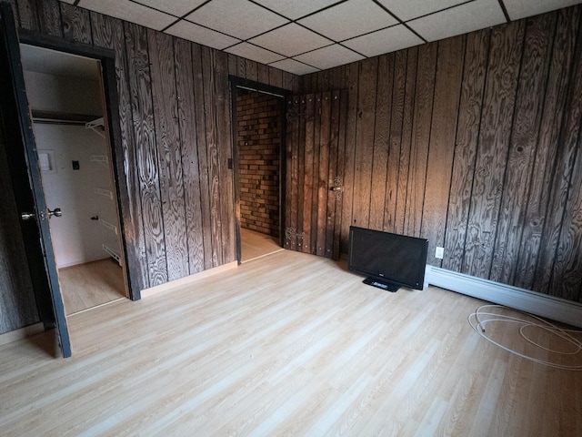 62 Hancock Ave, Jersey City, NJ 07307 - empty room with wood finished floors, wooden walls, and baseboards