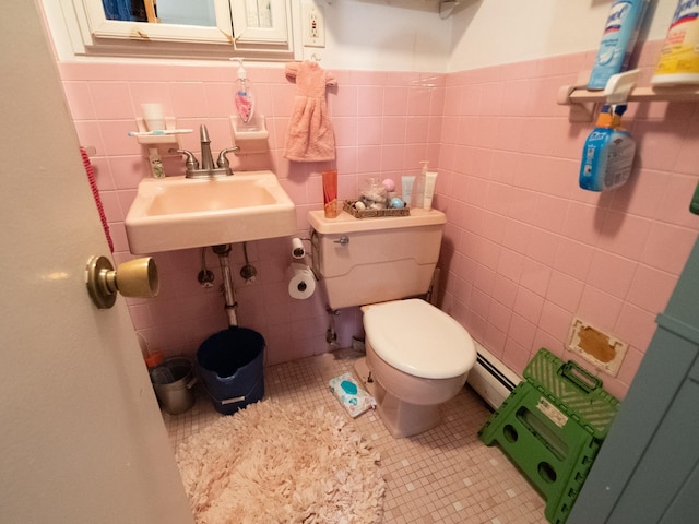 62 Hancock Ave, Jersey City, NJ 07307 - bathroom featuring a sink, a baseboard radiator, tile walls, toilet, and a wainscoted wall
