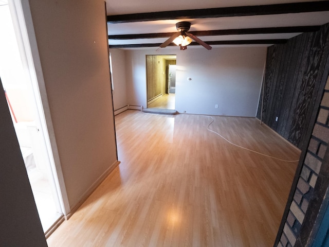 62 Hancock Ave, Jersey City, NJ 07307 - spare room with light wood-style floors, beam ceiling, a ceiling fan, and a baseboard heating unit