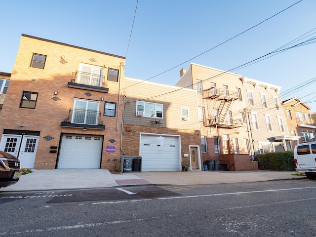 62 Hancock Ave, Jersey City, NJ 07307 - multi unit property with a garage, brick siding, and driveway