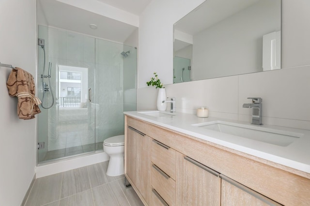 bathroom with walk in shower, decorative backsplash, vanity, and toilet