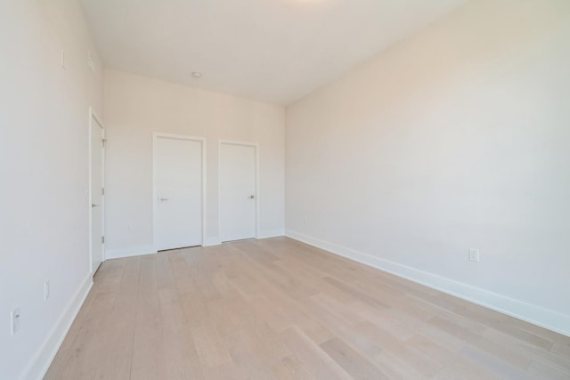 202 Merseles St Unit 503, Jersey City, NJ 07302 - unfurnished bedroom with light wood finished floors and baseboards