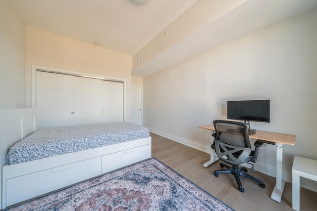 202 Merseles St Unit 503, Jersey City, NJ 07302 - bedroom with wood finished floors, a closet, and an office area