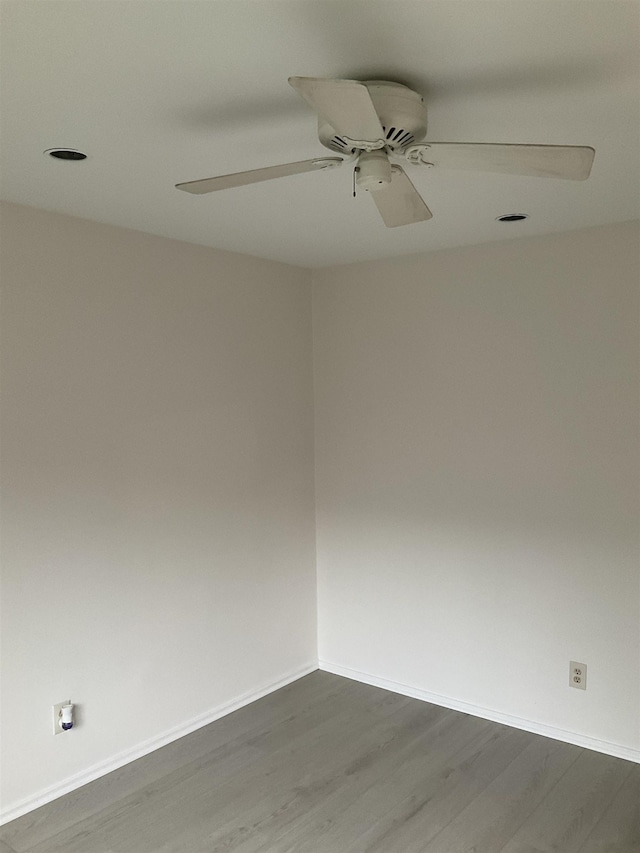 empty room featuring light hardwood / wood-style flooring and ceiling fan