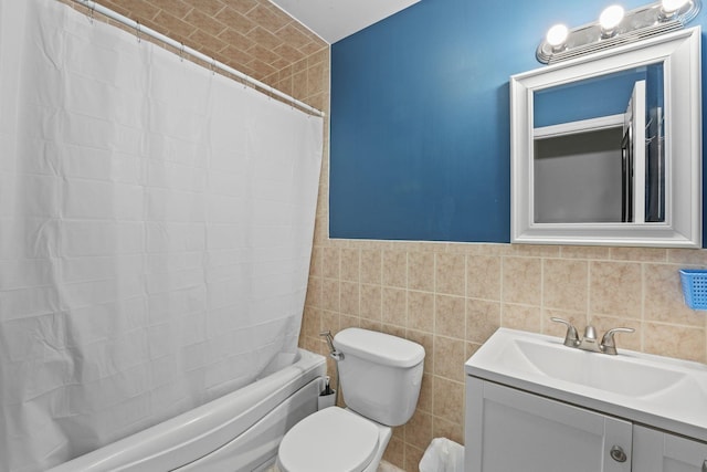 full bath with toilet, shower / bath combination with curtain, tile walls, and vanity