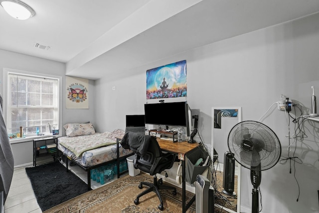 bedroom featuring light tile patterned floors and visible vents