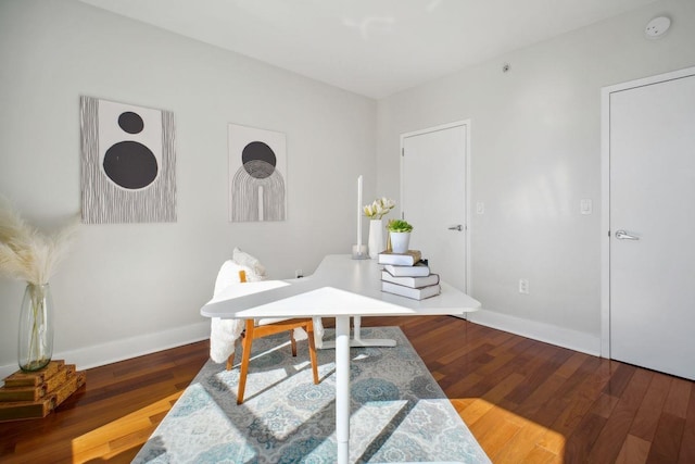 office featuring dark wood-style flooring and baseboards