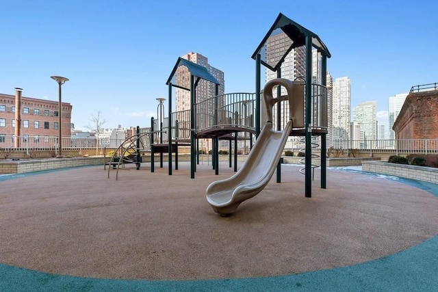 community jungle gym featuring a city view