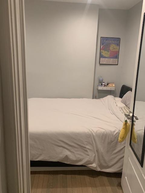 bedroom with wood finished floors