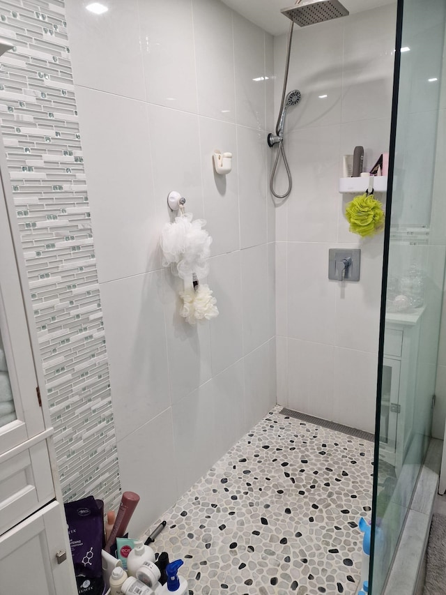 bathroom with a shower stall