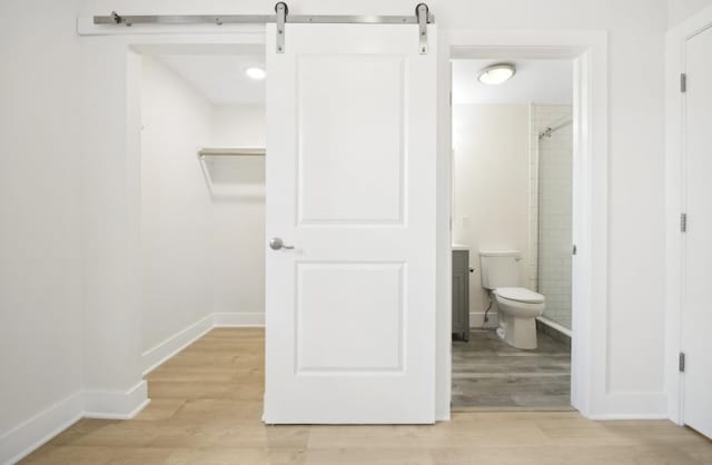 107 Laidlaw Ave Unit 2, Jersey City, NJ 07306 - full bath featuring wood finished floors, a tile shower, toilet, and baseboards