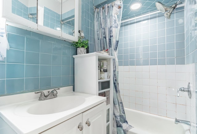 bathroom featuring shower / bath combo and vanity