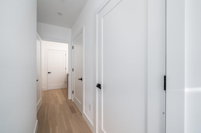 hallway with light wood-type flooring