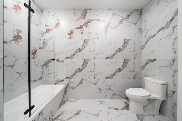 bathroom featuring a relaxing tiled tub and toilet