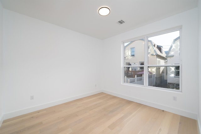 unfurnished room featuring wood-type flooring