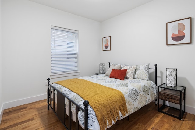 185 Gates Ave, Jersey City, NJ 07305 - bedroom with baseboards and wood finished floors