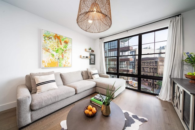 386 5th St Unit 404, Jersey City, NJ 07302 - living room with wood finished floors and a chandelier
