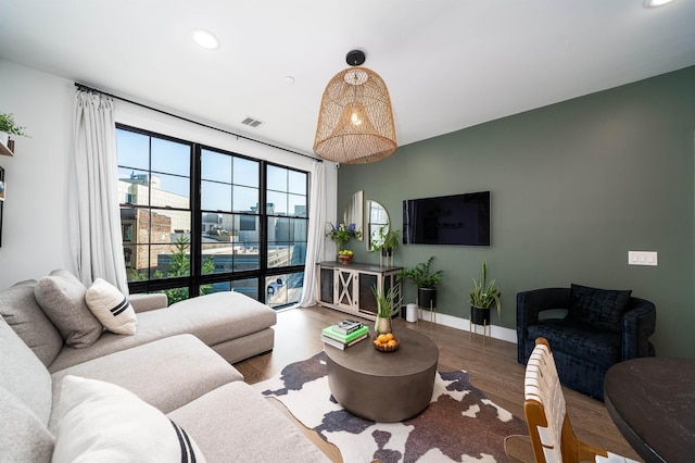 386 5th St Unit 404, Jersey City, NJ 07302 - living room with wood finished floors and recessed lighting