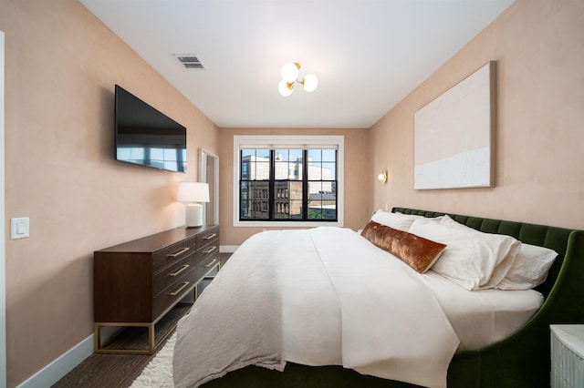 386 5th St Unit 404, Jersey City, NJ 07302 - bedroom with baseboards and dark wood-style floors