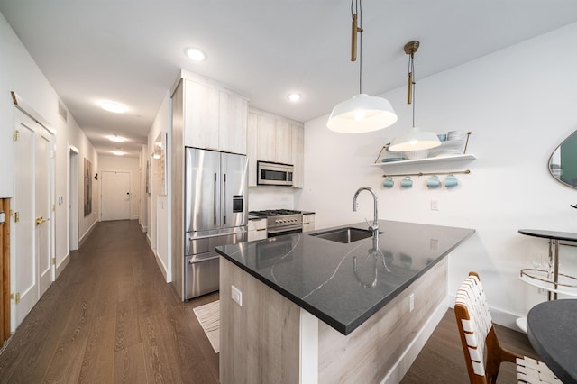 386 5th St Unit 404, Jersey City, NJ 07302 - kitchen with stainless steel appliances, dark wood finished floors, a peninsula, dark countertops, and recessed lighting