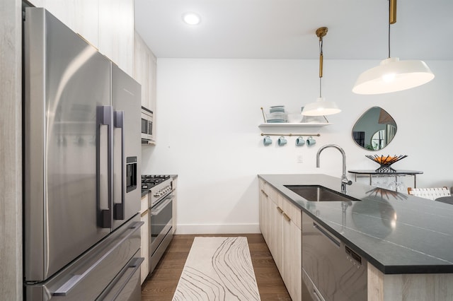 386 5th St Unit 404, Jersey City, NJ 07302 - kitchen featuring stainless steel appliances, a peninsula, modern cabinets, dark countertops, and dark wood-type flooring