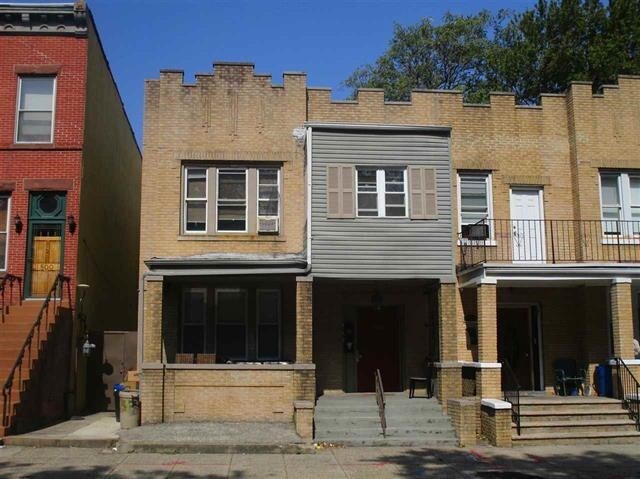 798 Grand St, Jersey City, NJ 07304 - view of front of home featuring brick siding