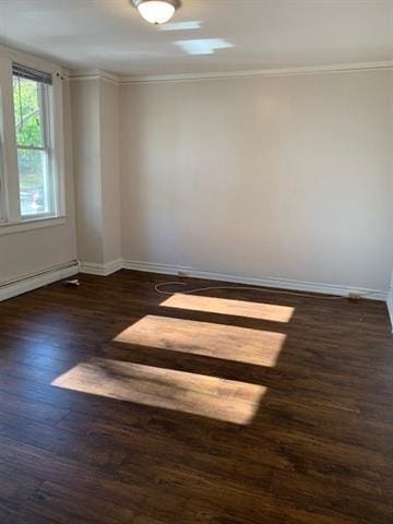 798 Grand St, Jersey City, NJ 07304 - empty room featuring dark wood-style floors, crown molding, and a baseboard radiator