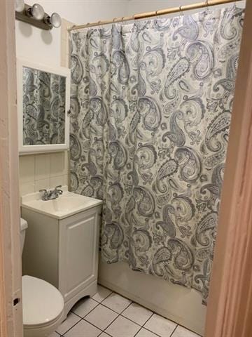 798 Grand St, Jersey City, NJ 07304 - bathroom featuring tile patterned floors, vanity, and shower / bath combination with curtain