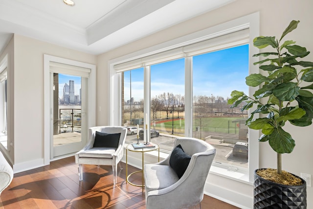 150 Henley Pl Unit 201, Weehawken, NJ 07086 - living area with hardwood / wood-style floors, recessed lighting, a tray ceiling, baseboards, and crown molding