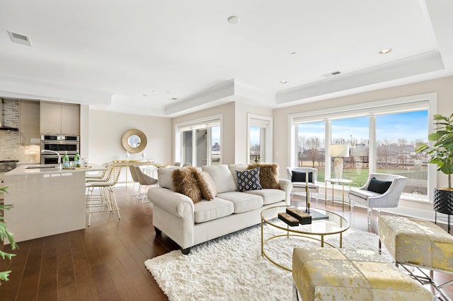 150 Henley Pl Unit 201, Weehawken, NJ 07086 - living room with a tray ceiling, dark wood finished floors, and recessed lighting
