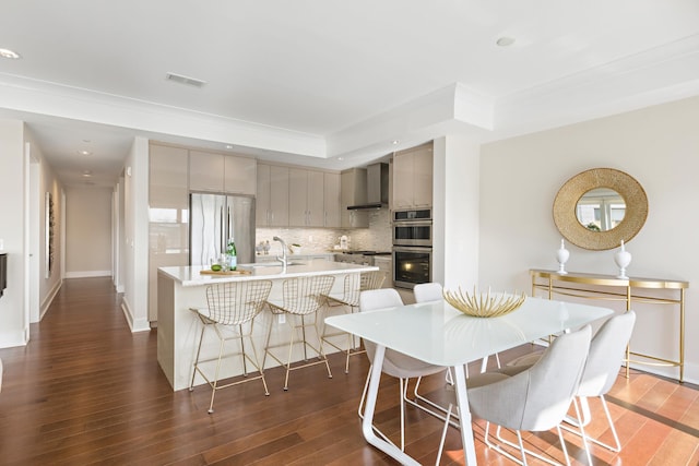 150 Henley Pl Unit 201, Weehawken, NJ 07086 - kitchen with appliances with stainless steel finishes, gray cabinetry, tasteful backsplash, light countertops, and dark wood finished floors
