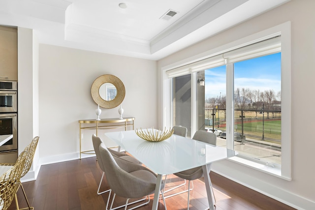 150 Henley Pl Unit 201, Weehawken, NJ 07086 - dining area with a raised ceiling, dark wood-type flooring, baseboards, and ornamental molding