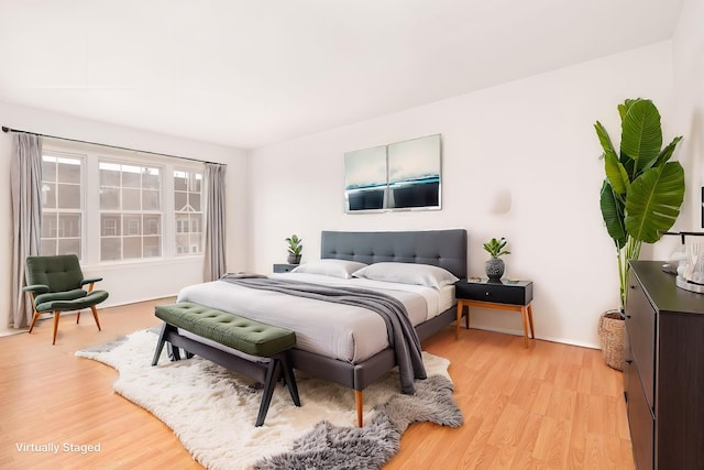 bedroom with light wood-type flooring