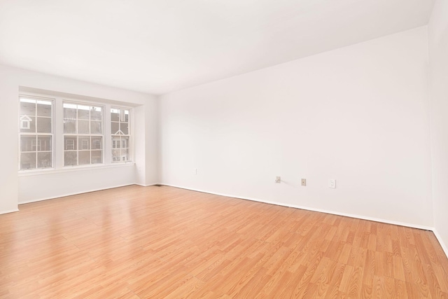 unfurnished room featuring light wood finished floors