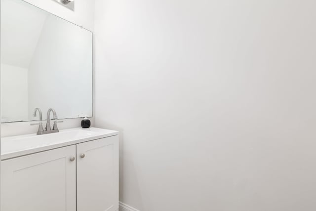 bathroom featuring vanity and baseboards