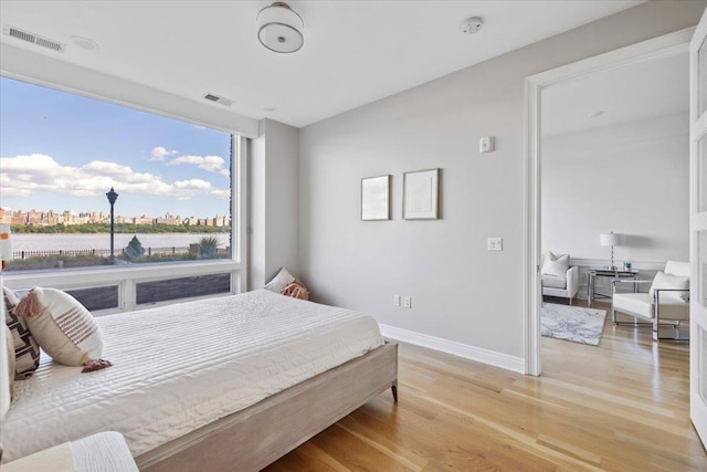 9 Somerset Ln Unit 118, Edgewater, NJ 07020 - bedroom with light wood-style floors and baseboards