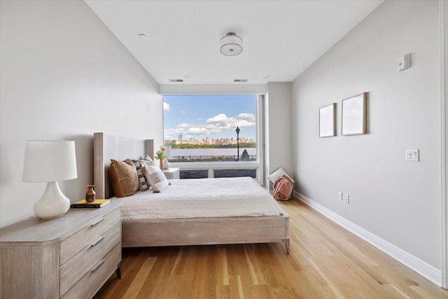 9 Somerset Ln Unit 118, Edgewater, NJ 07020 - bedroom with light wood-style floors and baseboards