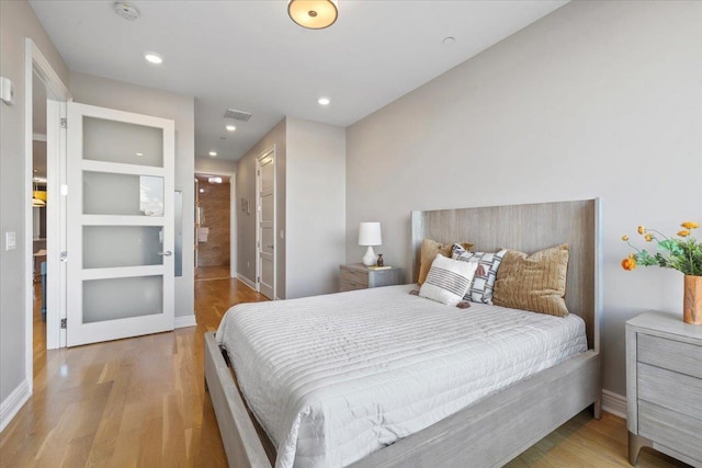9 Somerset Ln Unit 118, Edgewater, NJ 07020 - bedroom with wood finished floors, recessed lighting, and baseboards