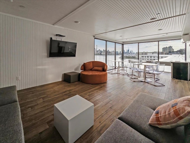 9 Somerset Ln Unit 118, Edgewater, NJ 07020 - living area featuring hardwood / wood-style flooring, expansive windows, and wood walls