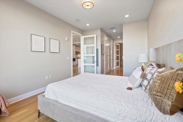 9 Somerset Ln Unit 118, Edgewater, NJ 07020 - bedroom with wood finished floors, baseboards, and recessed lighting