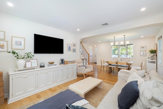 11 Dean Ct, Rutherford, NJ 07070 - living area with arched walkways, light wood finished floors, recessed lighting, and stairs