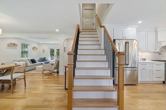 11 Dean Ct, Rutherford, NJ 07070 - stairs featuring wood finished floors, recessed lighting, arched walkways, and french doors